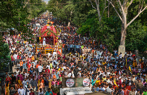 Devotees pull the chariot of Lord Jagannath, Lord Balabhadra and Goddess Subhadra during the 'Rath Yatra' festival, in New Delhi, Friday, June 27, 2025.