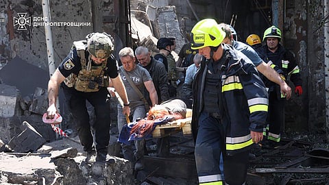 In this photo from June 24, 2025, rescuers carry an injured civilian following Russia's missile attack in Dnipro, Ukraine.