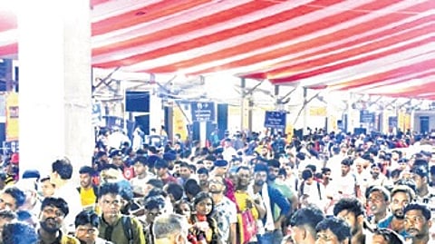 GRP, RPF officers managing passengers’ crowd at Puri railway station on Friday.