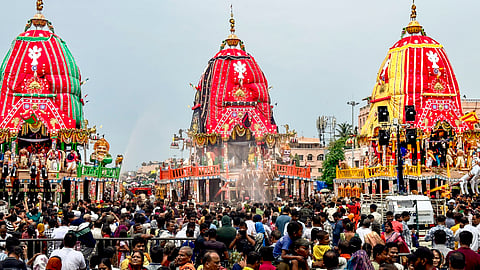 People during the annual 'Rath Yatra' festival celebration, in Puri, Odisha.