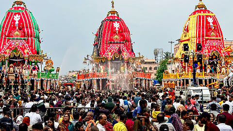 People during the annual 'Rath Yatra' festival celebration, in Puri, Odisha.