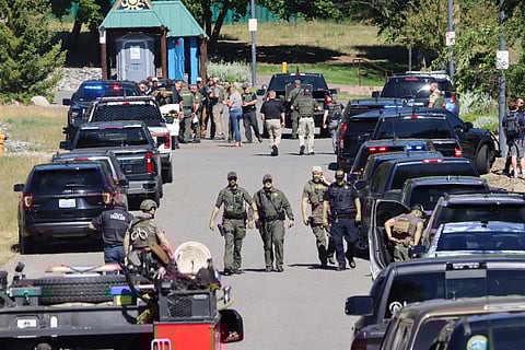Law enforcement and emergency responders at Cherry Hill Park off 15th Street on Sunday afternoon, June 29, 2025, following reports of an ambush shooting attack on Canfield Mountain, in Coeur d'Alene, Idaho.