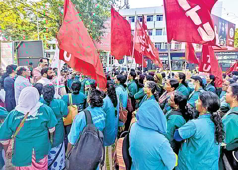 Haritha Karma Sena members protesting against the BJP councillors in front of the corporation's main office on Monday
