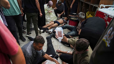 Palestinians wounded during Israeli strikes are treated in the Shifa Hospital, Gaza City, Monday, June 30, 2025.