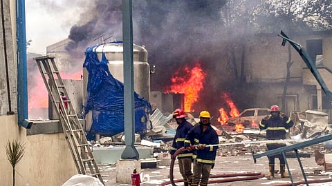 Firefighters try to extinguish a fire that broke out in a chemical factory, at Pashamylaram, in Medak district, Telangana.