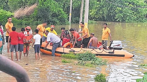 ODRAF personnel rescuing residents of a low-lying area in Baliapal block.