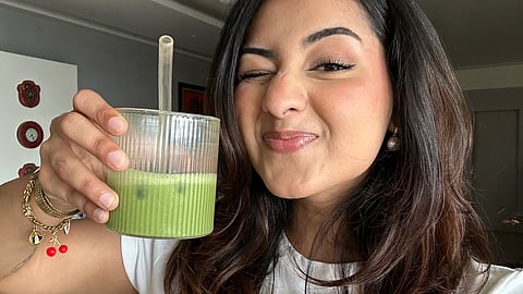 Influencer Anokhi Bhardwaj with iced matcha latte