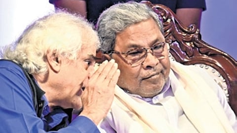 Chief Minister Siddaramaiah speaks to veteran journalist P Sainath during Press Day celebrations in Bengaluru on Tuesday.
