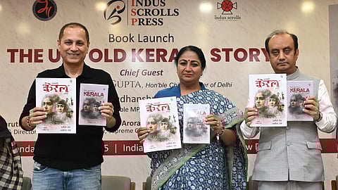 Delhi CM Rekha Gupta, BJP MP Sudhanshu Trivedi and Producer and Director Vipul Amrutlal Shah releasing a book The Untold Kerala Story written by Sudipto Sen and Ambika JK, during a function at the IIC in New Delhi on Monday 30 06 2025