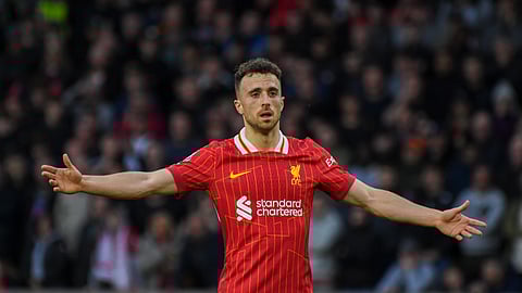 Liverpool's Diogo Jota gestures during the English Premier League soccer match between Wolverhampton Wanderers and Liverpool at the Molineux Stadium in Wolverhampton, England, Saturday, Sept. 28, 2024.
