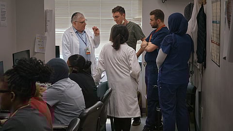 A group of resident doctors talks with a senior doctor inside Brookdale University Hospital and Medical Center on Tuesday, July 1, 2025, in the Brooklyn borough of New York.