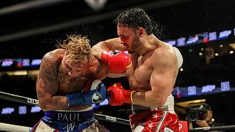 Julio Cesar Chavez Jr., right, punches Jake Paul during their cruiserweight boxing match on Saturday, June 28, 2025, in Anaheim, California.