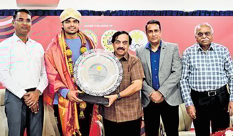Javelin ace and double Olympic medallist Neeraj Chopra is felicitated by (from left) Chethan R, Commissioner, Department of Youth Empowerment and Sports (DYES), Dr K Govindaraj, MLC and president of FIBA Asia & KOA, Naveen Raj Singh, Principal Secretary, DYES, and T Anantharaju, Secretary General of KOA, at KOA Bhavan in Bengaluru on Thursday