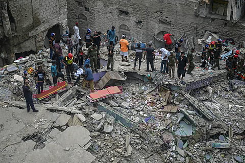 A rescue operation is underway at the site where a residential building collapsed in Karachi on July 4, 2025. A five-storey building collapse in Pakistan on July 4 killed at least five people and left six injured, with more victims trapped under the rubble, police said.
