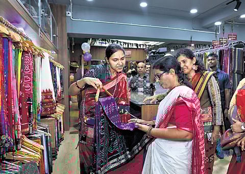 Speaker Surama Padhy checks out the collections at the GI store in Bhubaneswar, on Friday