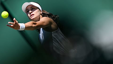 Turkey's Zeynep Sonmez serves to China's Wang Xinyu during their women's singles second round tennis match at the 2025 Wimbledon Championships on July 3, 2025.