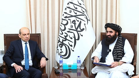 This handout photograph taken on July 3, 2025, and released by Afghanistan's Ministry of Foreign Affairs shows Afghanistan’s Foreign Minister Amir Khan Muttaqi (R) meeting with Russia’s ambassador to Afghanistan, Dmitry Zhirnov, at the foreign ministry in Kabul.
