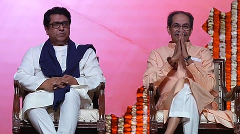 Shiv Sena (UBT) chief Uddhav Thackeray (right) shares the stage with cousin and MNS chief Raj Thackeray at a rally in Mumbai.