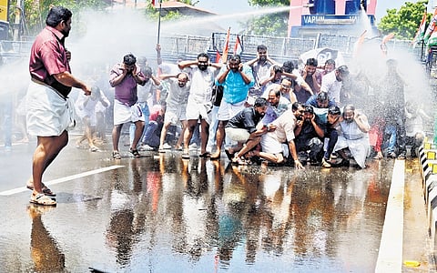 Police spraying water cannon on Youth Congress workers, who had assembled in front of Health Minister Veena George's official residence seeking her resignation over alleged administrative inefficiency