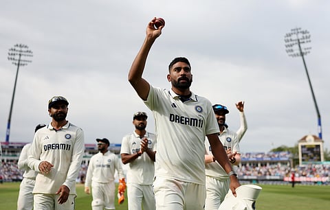 Mohammed Siraj leaves the field holding the ball as his teammates acknowledge the pacer's feat on Day 3 of the second Test in Edgbaston