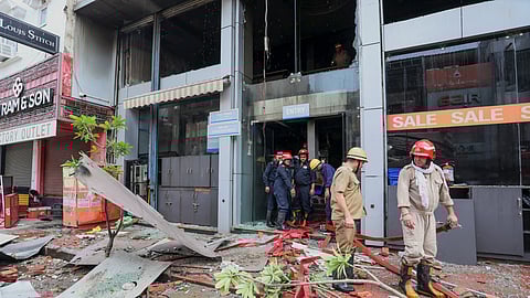 Fire personnel at a Vishal Mega Mart showroom, where a fire broke out on Friday, at Karol Bagh area, in New Delhi, Saturday, July 5, 2025.