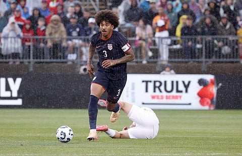 United States defender Chris Richards (3) dribble the ball up the field past a fallen Turkey defender during the first half of an international friendly soccer game, Saturday, June 7, 2025, in East Hartford, Conn.