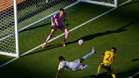 Real Madrid's Kylian Mbappe, bottom, scores his side's 3rd goal during the Club World Cup quarterfinal soccer match between Real Madrid and Borussia Dortmund on July 5, 2025.