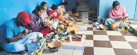 Youths undergoing training in Tumba craft at Prerana Art & Craft centre in Rayagada. (Below) Tribals wait to sell their bottle gourd stock at a village in Rayagada | Express
