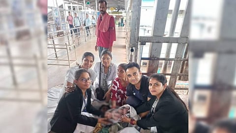 Major Rohit Bachwala and women TTE posing with the mother and child.