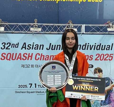 Squash player Anahat Singh poses with the medal and the trophy after winning the Asian Junior Squash Championships in Korea recently