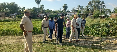 Police searching the area. A dog squad was also pressed into service to ascertain exit route of the accused.