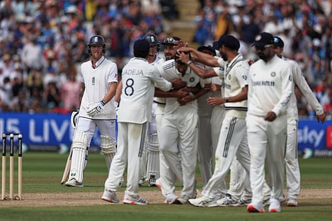 Indian players celebrate the dismissal of England captain Ben Stokes, left, on day five of the second cricket test match between England and India at Edgbaston in Birmingham, England, Sunday, July 6, 2025.