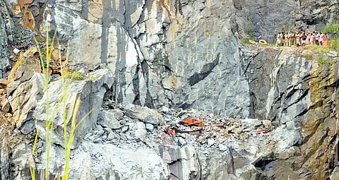 The mangled remains of the excavator in the quarry where a worker was killed after a rockfall, in Payyanamon, Pathanamthitta