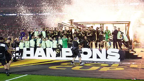 Mexico celebrates with the cup after beating the United States 2-1 on Sunday night for its record 10th CONCACAF Gold Cup title.