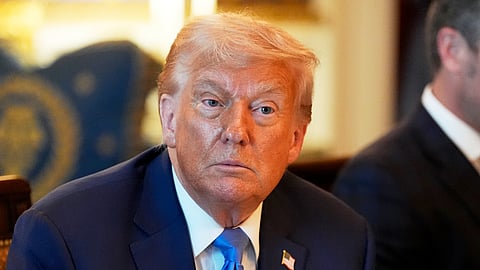 US President Donald Trump listens during a meeting in the Blue Room of the White House, Monday, July 7, 2025, in Washington.