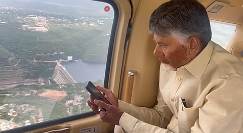 CM Nara Chandrababu Naidu takes a look at the Srisailam reservoir from his chopper on Tuesday.