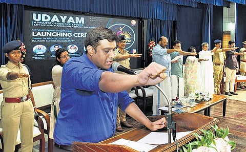 Ernakulam District Collector N S K Umesh taking the anti-drug pledge as part of Udayam — an initiative for a drug-free Kochi led by the Kochi city police — at Rajagiri School, Kalamassery, on Tuesday