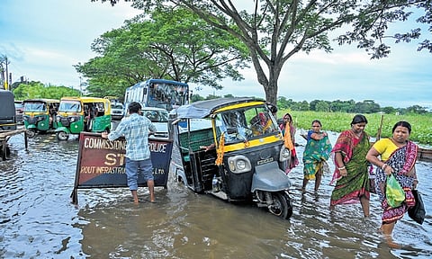 Vehicles stuck on the flooded Nandankanan Road near Kanjia lake that connects Bhubaneswar to Cuttack, after a spell of rain on Tuesday.