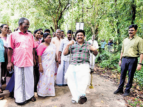 Transport Minister K B Ganesh Kumar enjoying a swing arranged at Pathiramanal Island in Muhamma panchayat on Tuesday