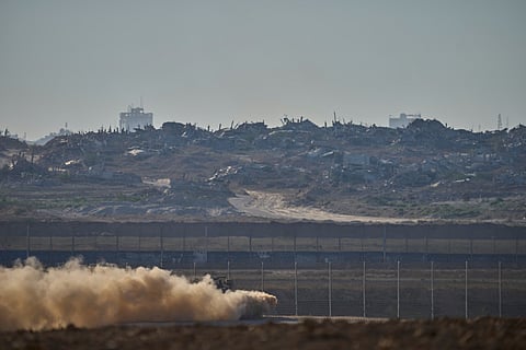 An Israeli army APC moves along the border of the gaza strip in southern Israel, Sunday, July 6, 2025.