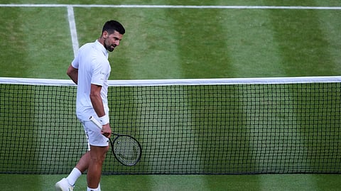 Serbia's Novak Djokovic celebrates after beating Italy's Flavio Cobolli during a quarterfinal men's singles match at the Wimbledon Tennis Championships in London, Wednesday, July 9, 2025.