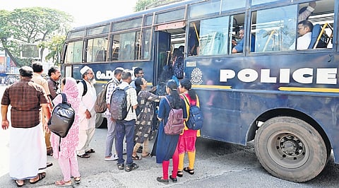 Police provide free transportation to passengers at Thampanoor on
Wednesday as more vehicles stayed off the roads