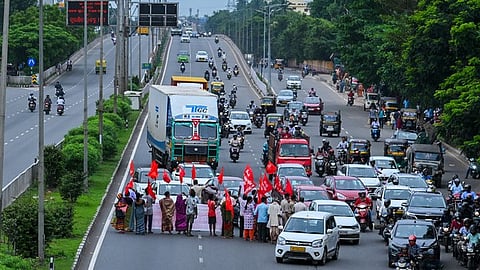 Traffic movement affected on National Highway 16 as various trade and labour unions stage a road block as part of Bharat Bandh.