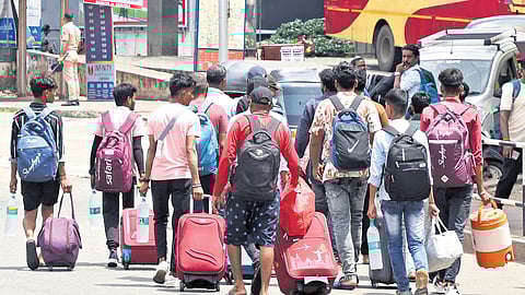 With public transport crippled by the strike on Wednesday, stranded passengers make their way through Thampanoor KSRTC bus station
