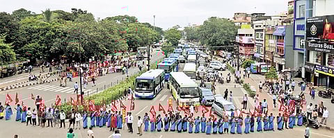 Trade union activists stage demonstration at Rajmahal Square in Bhubaneswar