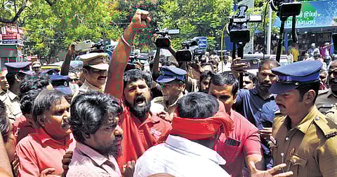 Trade unions staging a road blockade in Chennai on Wednesday.