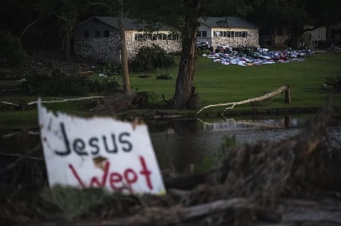 Camper’s belongings sit outside one of Camp Mystic’s cabins near the Guadalupe River after a flash flood swept through the area Monday, July 7, 2025, in Hunt, Texas.