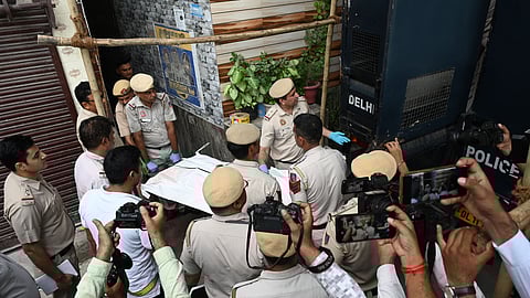 Police personnels at the spot where double murder of a woman and an infant took place at Civil Lines area, in New Delhi on Tuesday