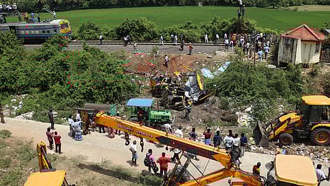 Three killed as train rams into a school van near Cuddalore.