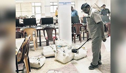 A bomb squad personnel conducts a search at the City Civil Court premises in Hyderabad on Tuesday. The threat later turned out to be a hoax